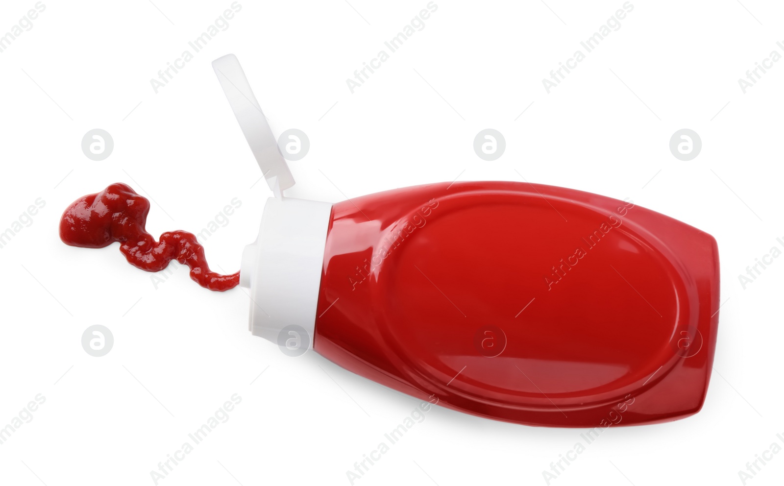 Photo of Bottle of tasty ketchup and stain isolated on white, top view