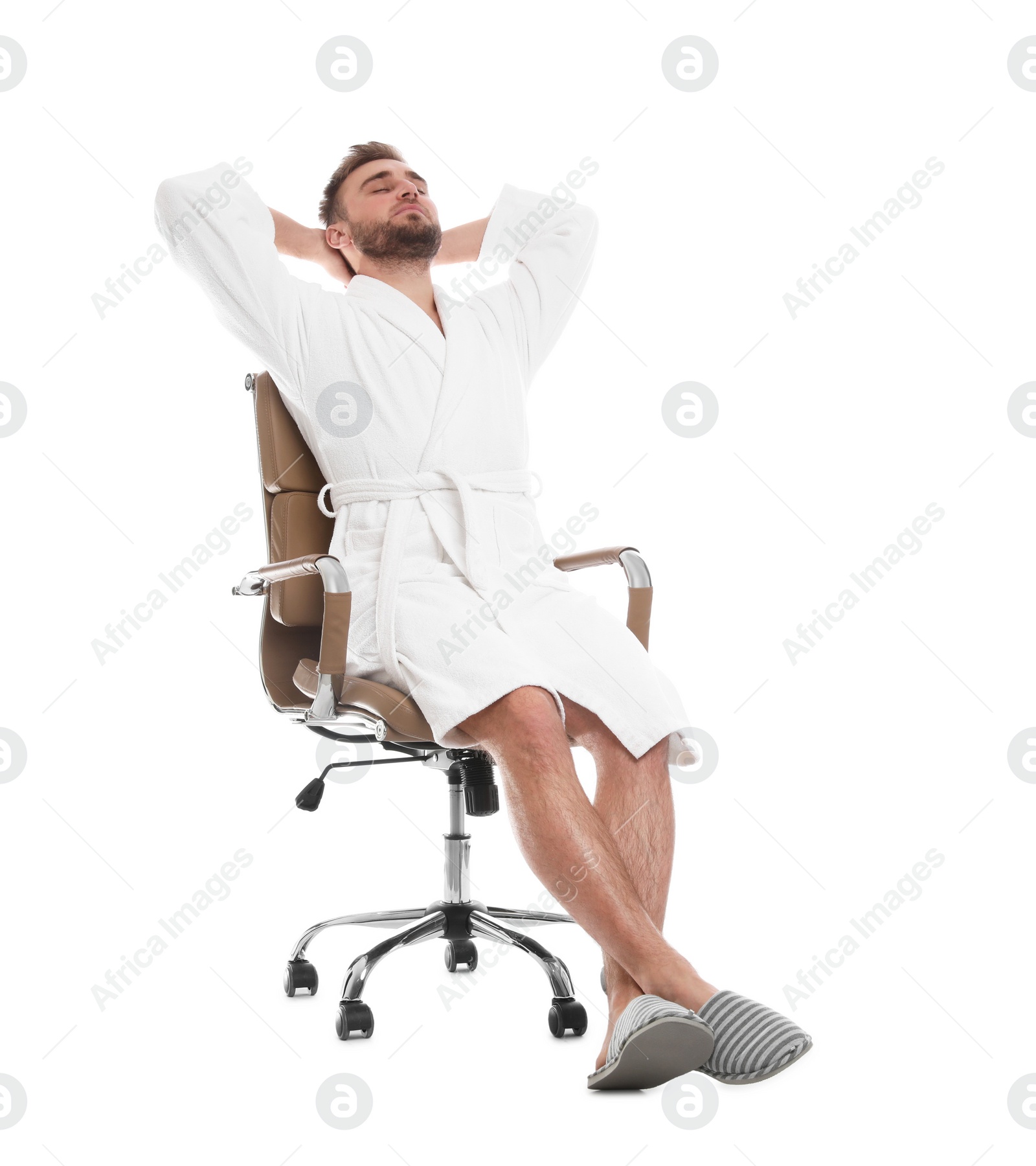 Photo of Handsome man wearing bathrobe resting in chair on white background