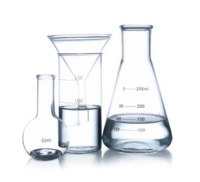 Different laboratory glassware with water isolated on white