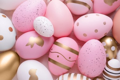 Photo of Beautifully painted Easter eggs as background, top view