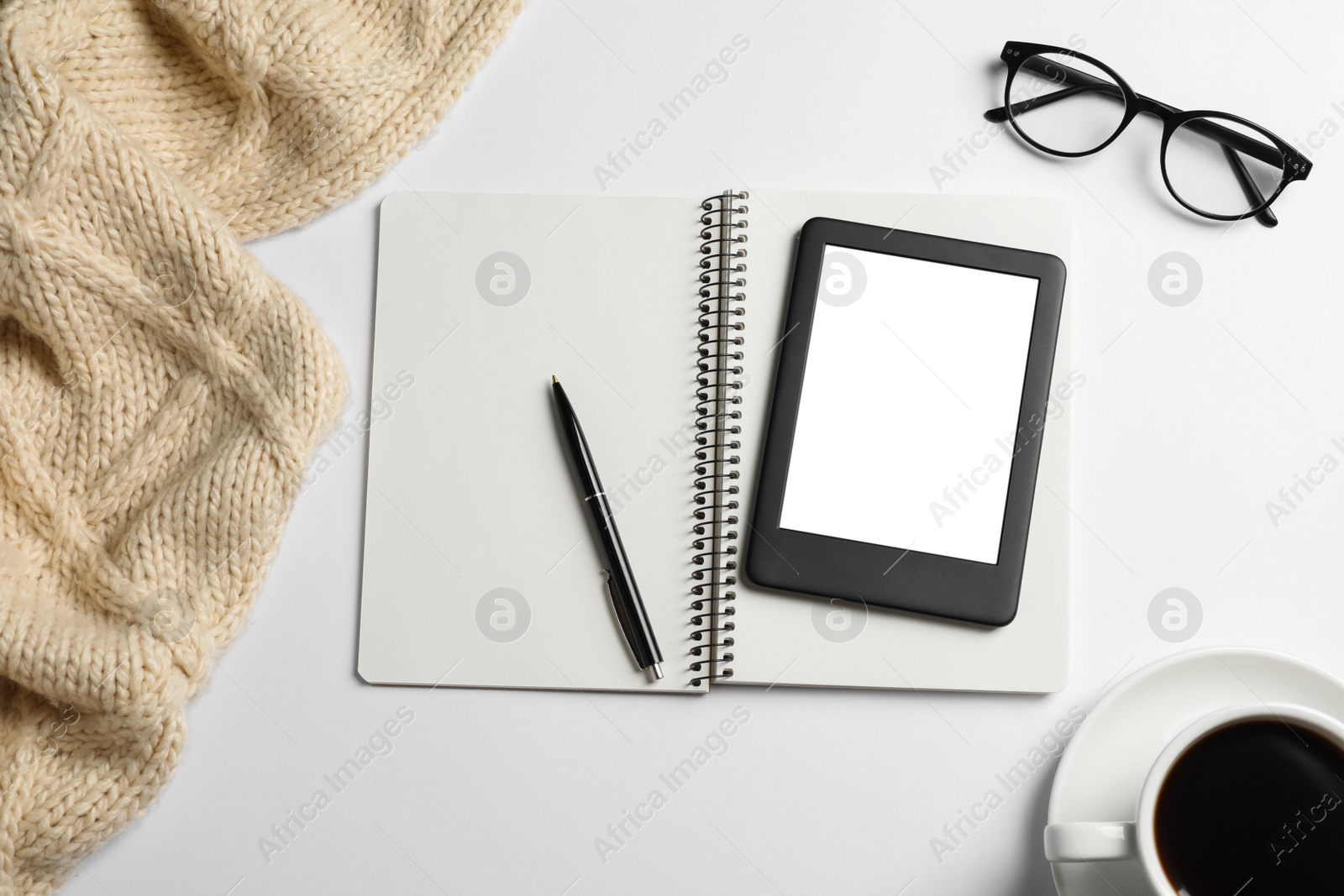 Photo of Flat lay composition with modern e-book reader on white table