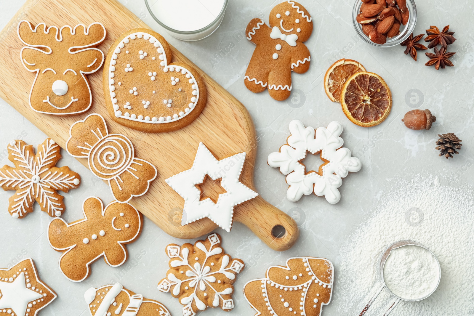 Photo of Flat lay composition with delicious homemade Christmas cookies on grey marble table