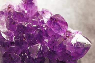 Beautiful purple amethyst gemstone on table, closeup