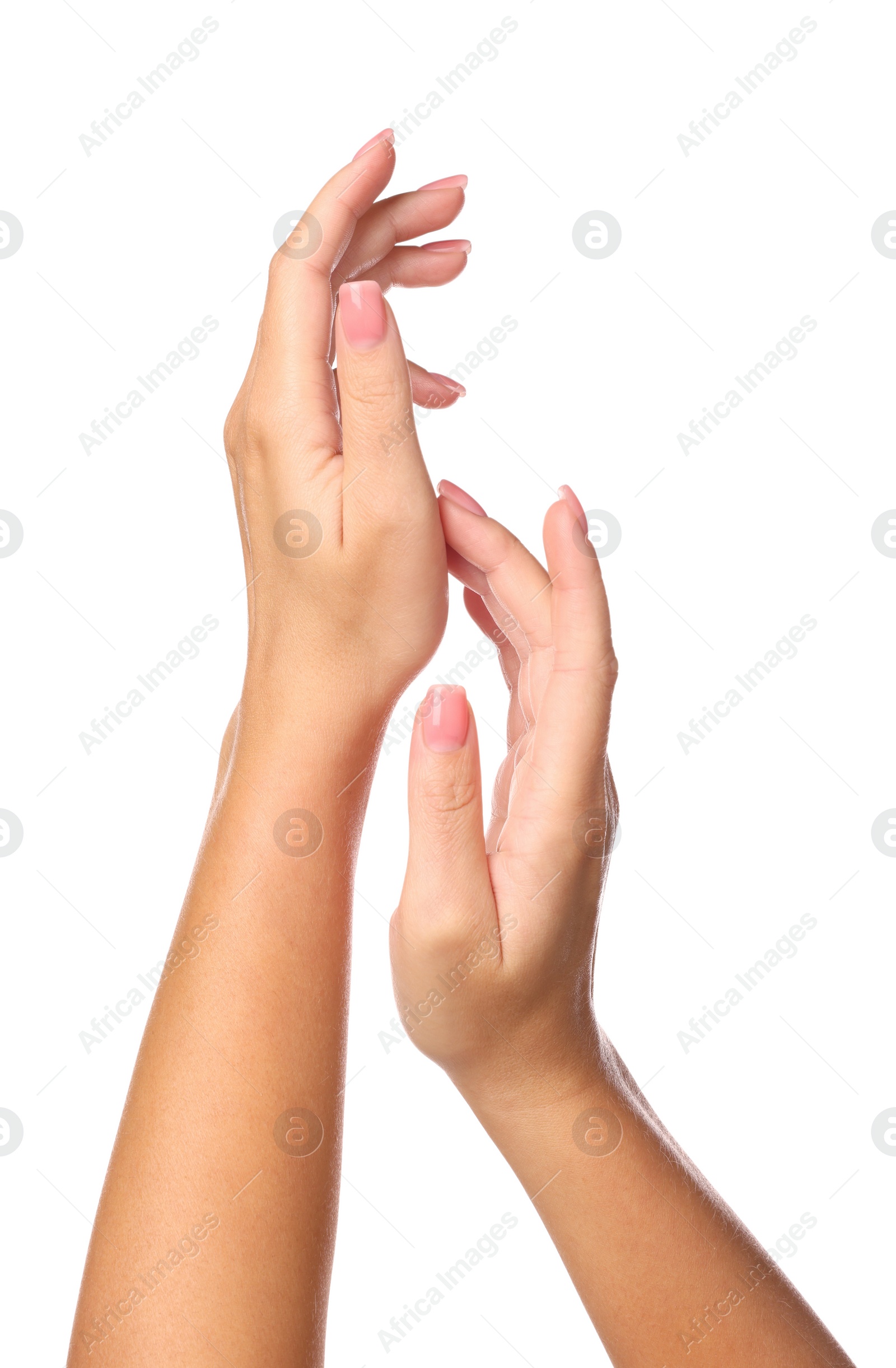 Photo of Woman showing hands with nude manicure on white background, closeup