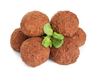 Photo of Delicious falafel balls and lambs lettuce on white background. Vegan meat products