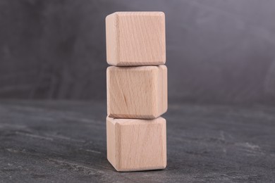 Photo of International Organization for Standardization. Cubes with abbreviation ISO on gray textured table