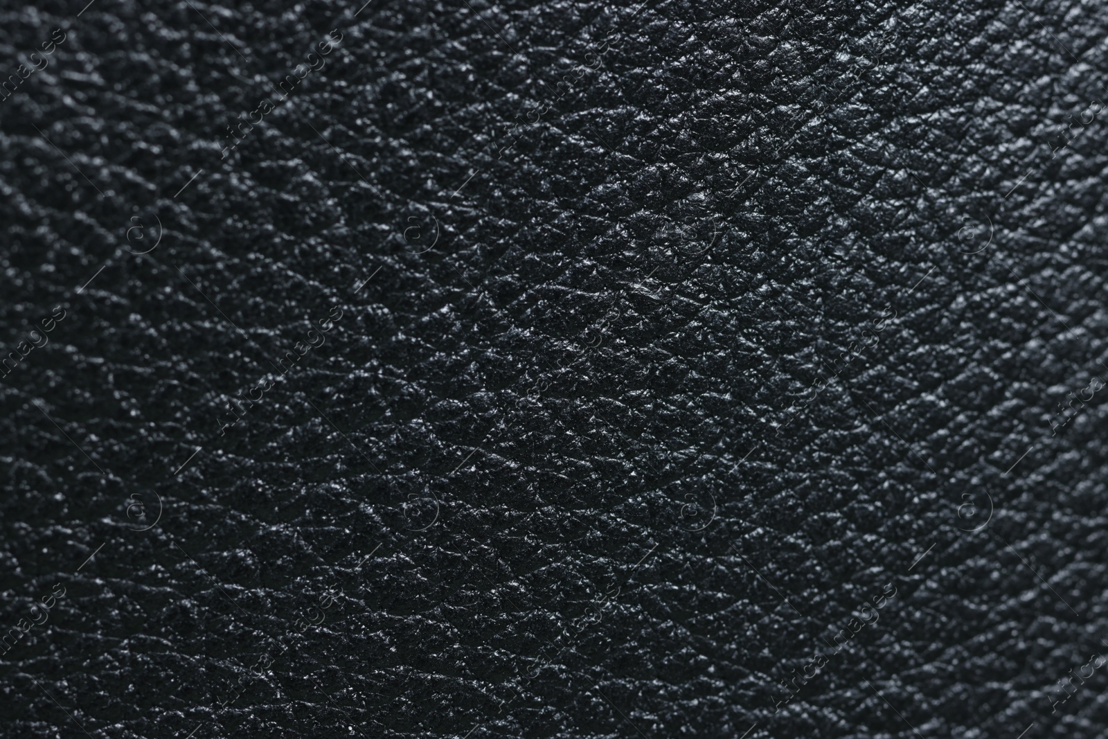 Photo of Black natural leather as background, top view