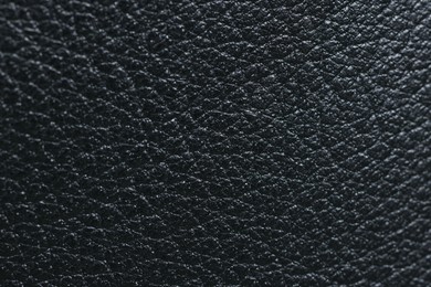 Photo of Black natural leather as background, top view