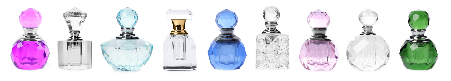 Image of Set with different bottles of perfume on white background, banner design 