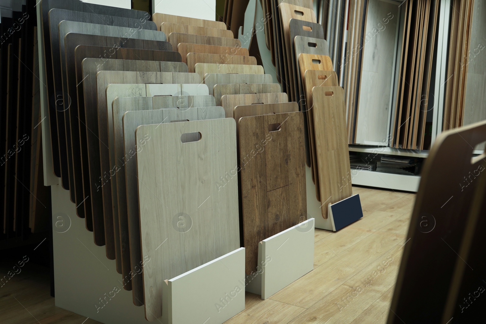 Photo of Many different samples of wooden flooring in store