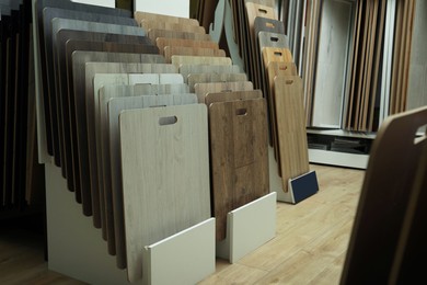 Many different samples of wooden flooring in store