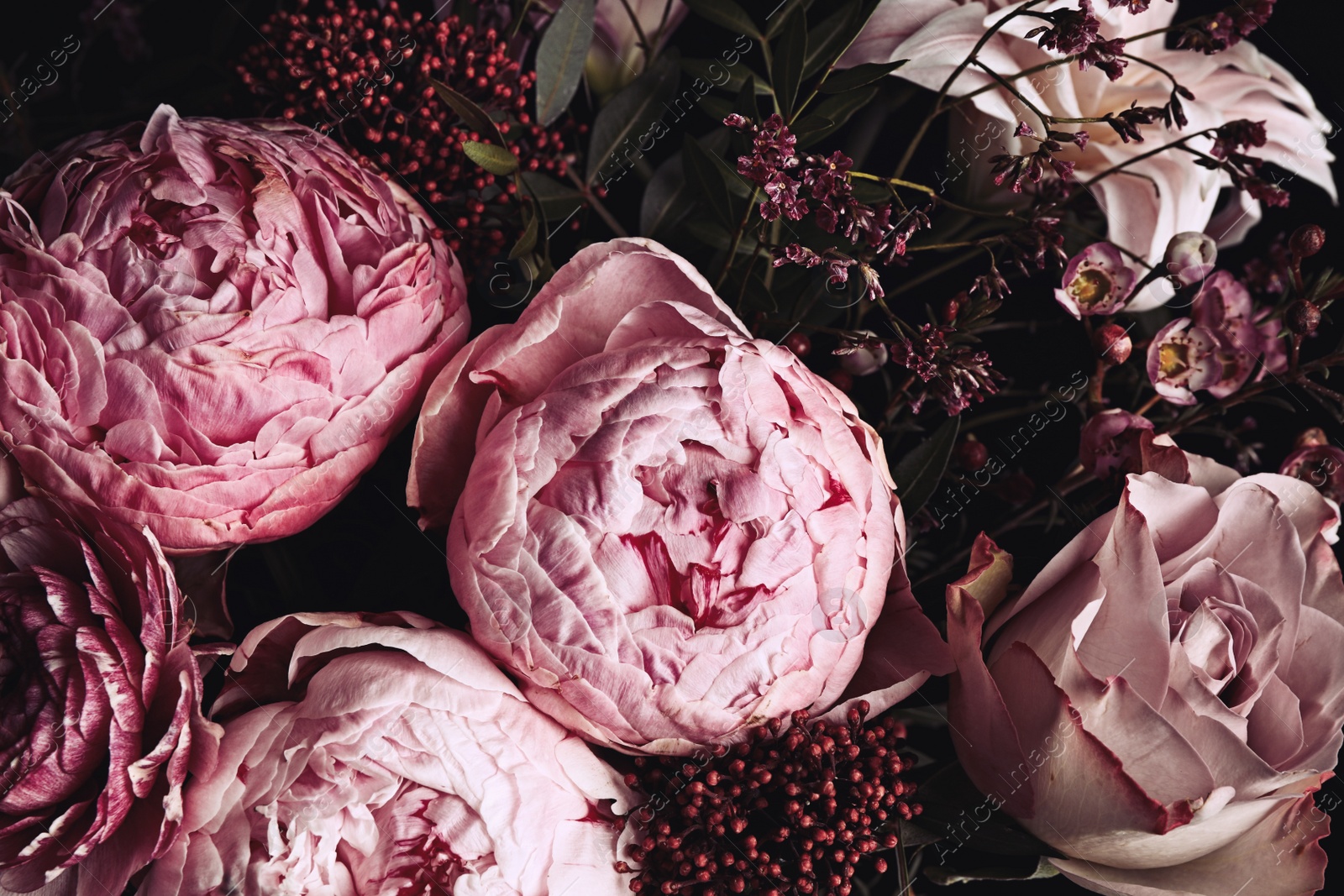 Photo of Beautiful bouquet of different flowers, closeup. Floral card design with dark vintage effect