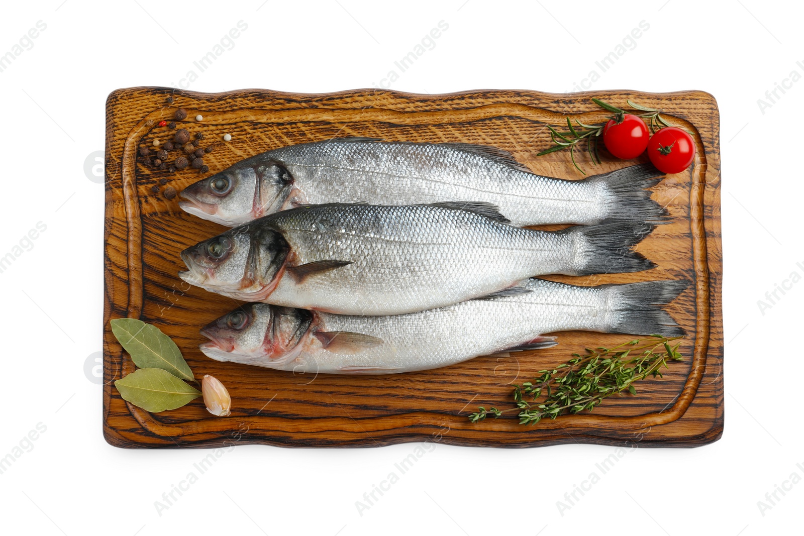 Photo of Board with fresh sea bass fish and ingredients on white background, top view