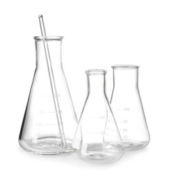 Empty laboratory flasks and stirring rod isolated on white