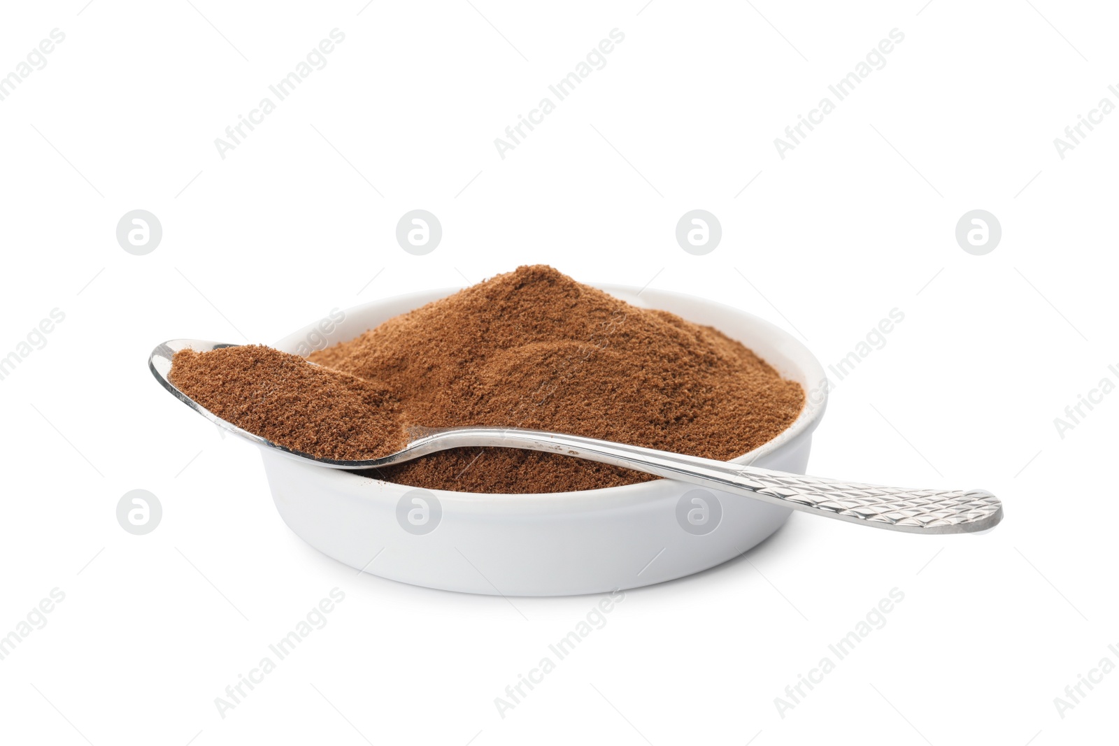 Photo of Plate and spoon of chicory powder on white background