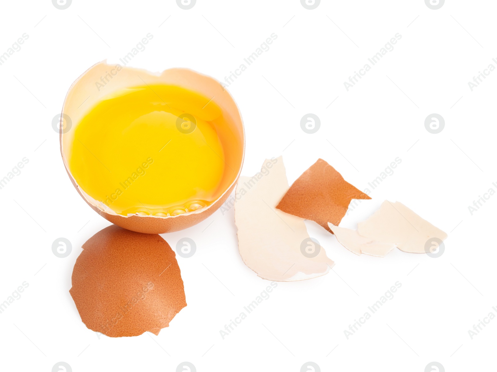 Photo of One cracked chicken egg isolated on white