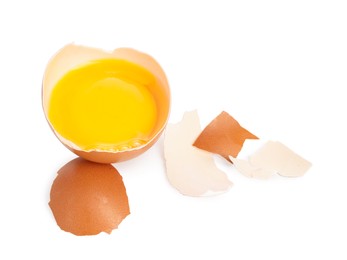 Photo of One cracked chicken egg isolated on white