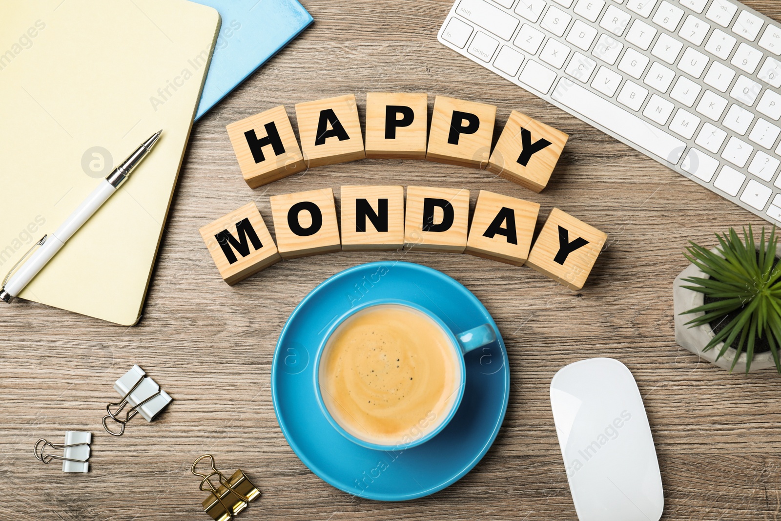 Photo of Flat lay composition with phrase Happy Monday made of cubes at workplace