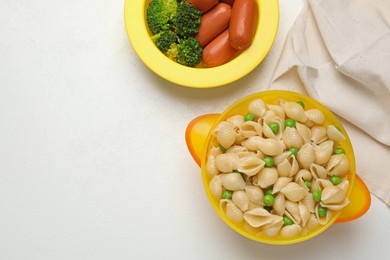 Bowl with tasty pasta on white table, flat lay. Space for text