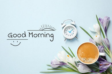 Image of Cup of coffee, crocuses and alarm clock on light background, flat lay. Good morning