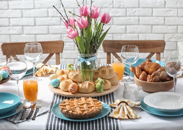 Festive Easter table setting with traditional meal at home