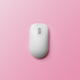 Image of Modern wireless computer mouse on pink background, top view