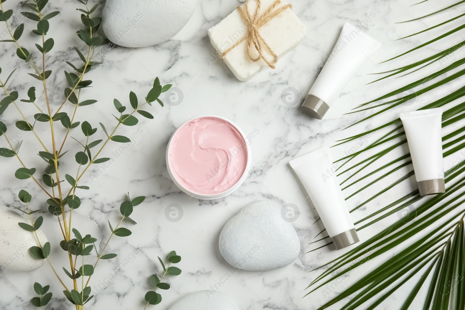 Photo of Flat lay composition with different body care products on marble background