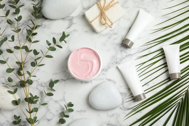 Flat lay composition with different body care products on marble background