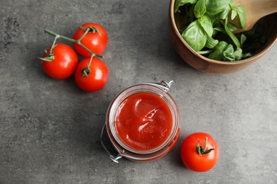 Composition with tasty homemade tomato sauce on table, top view