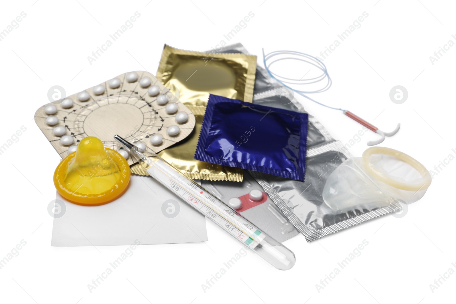 Photo of Contraceptive pills, condoms, intrauterine device and thermometer isolated on white. Different birth control methods