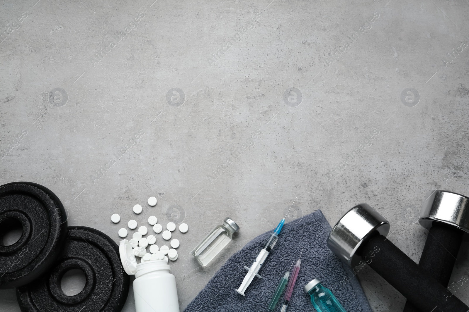 Photo of Different drugs and sports equipment on grey background, flat lay with space for text. Doping control