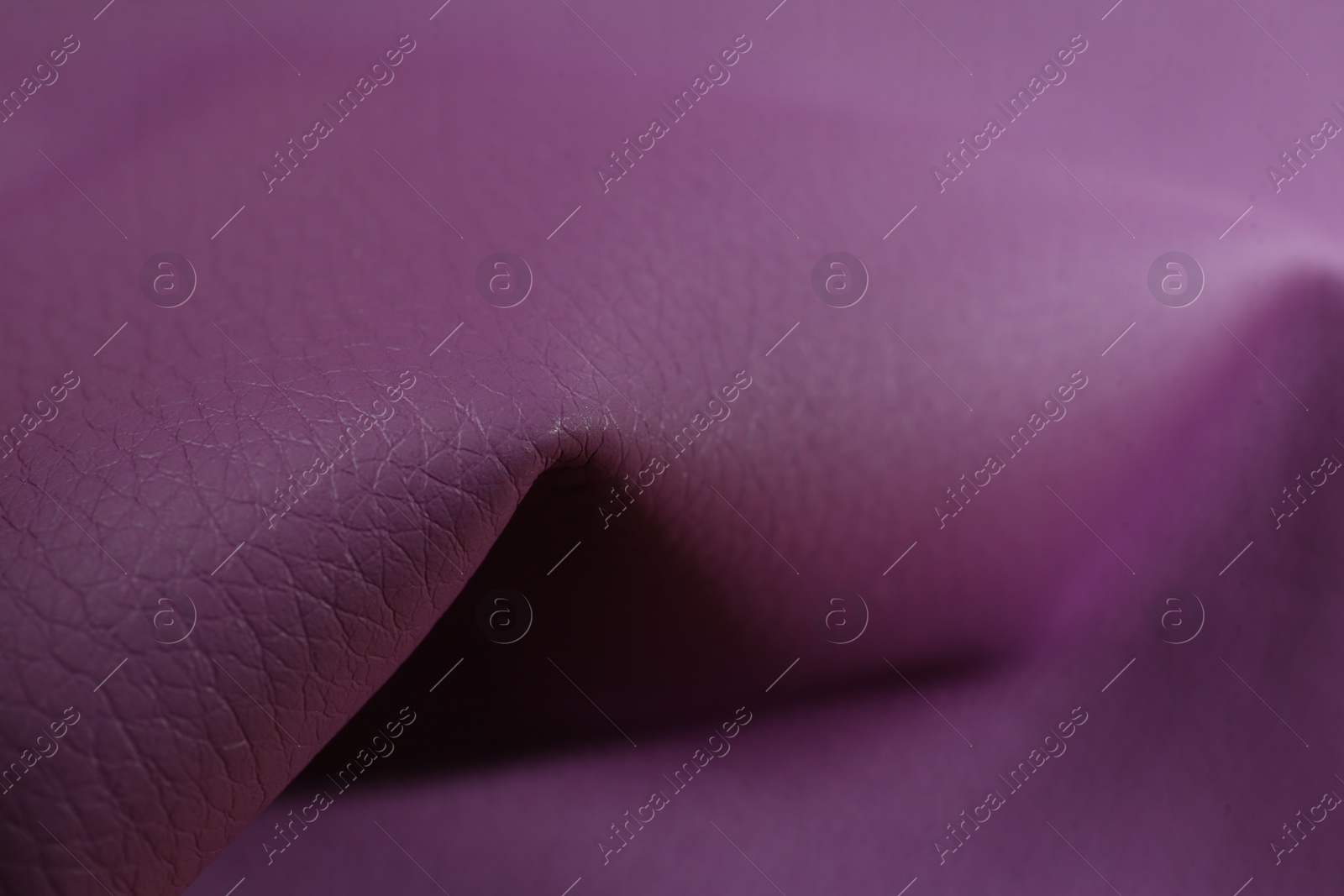 Photo of Beautiful purple leather as background, closeup view