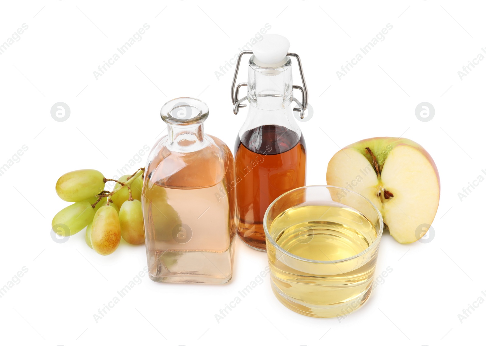 Photo of Different types of vinegar and ingredients isolated on white