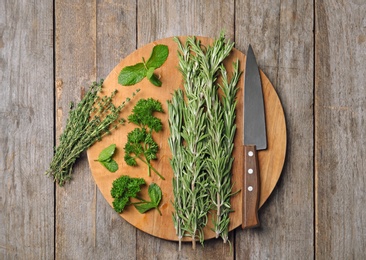 Photo of Flat lay composition with rosemary on table. Aromatic herbs