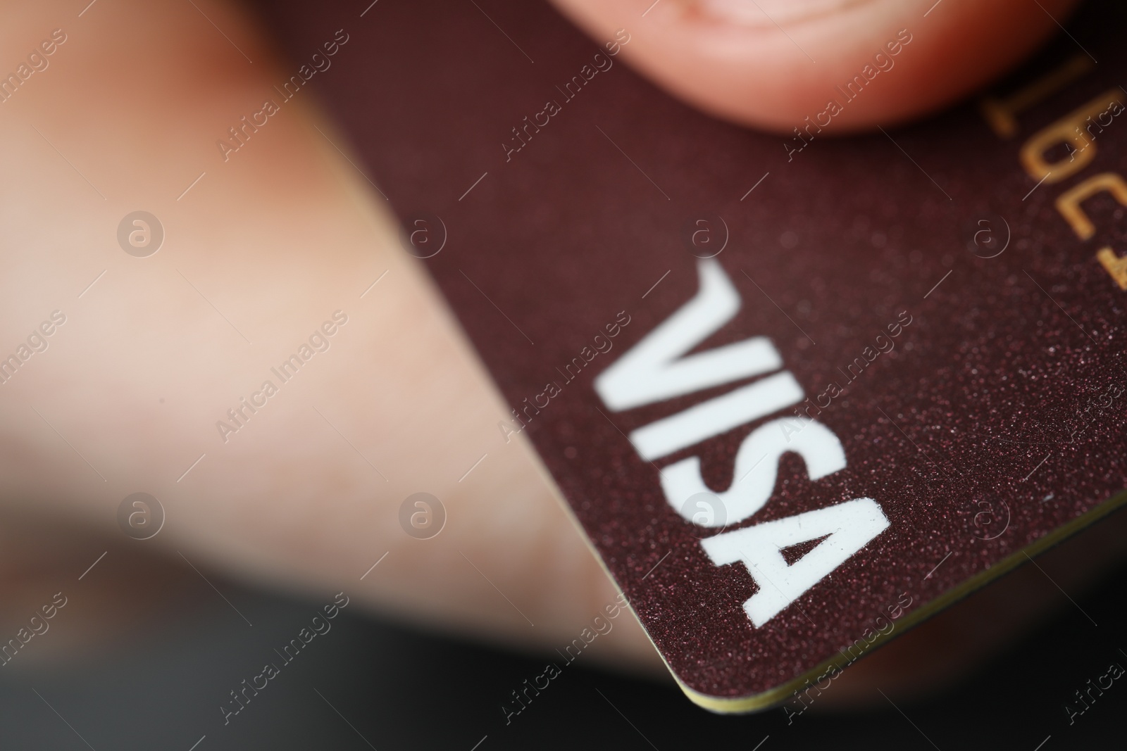 Photo of MYKOLAIV, UKRAINE - FEBRUARY 22, 2022: Woman holding Visa credit card, closeup. Space for text