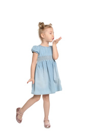 Cute little girl blowing air kiss on white background