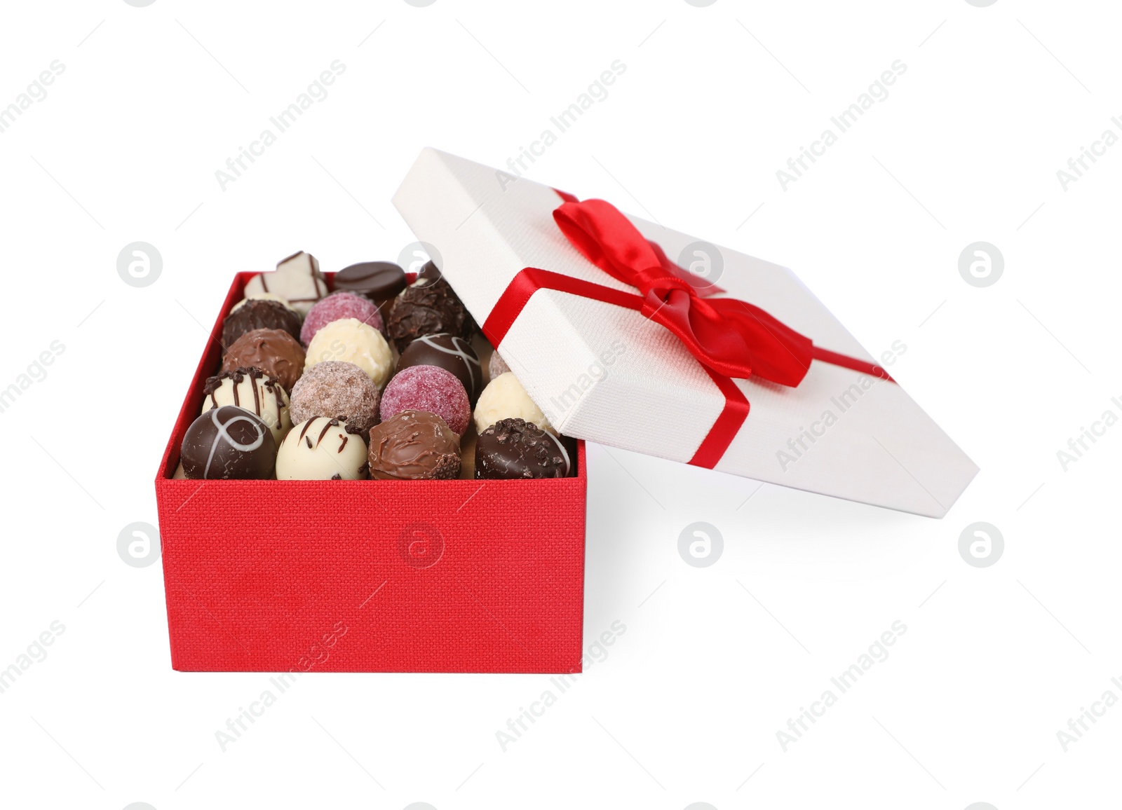 Red box with tasty chocolate candies isolated on white Photo of Red box with tasty chocolate candies isolated on white