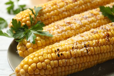 Tasty grilled corn with parmesan, closeup view