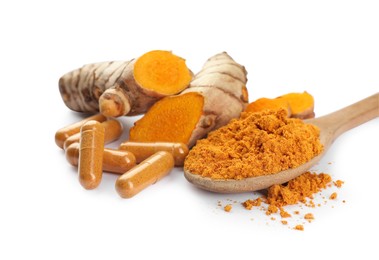 Photo of Spoon with aromatic turmeric powder, pills and raw roots isolated on white