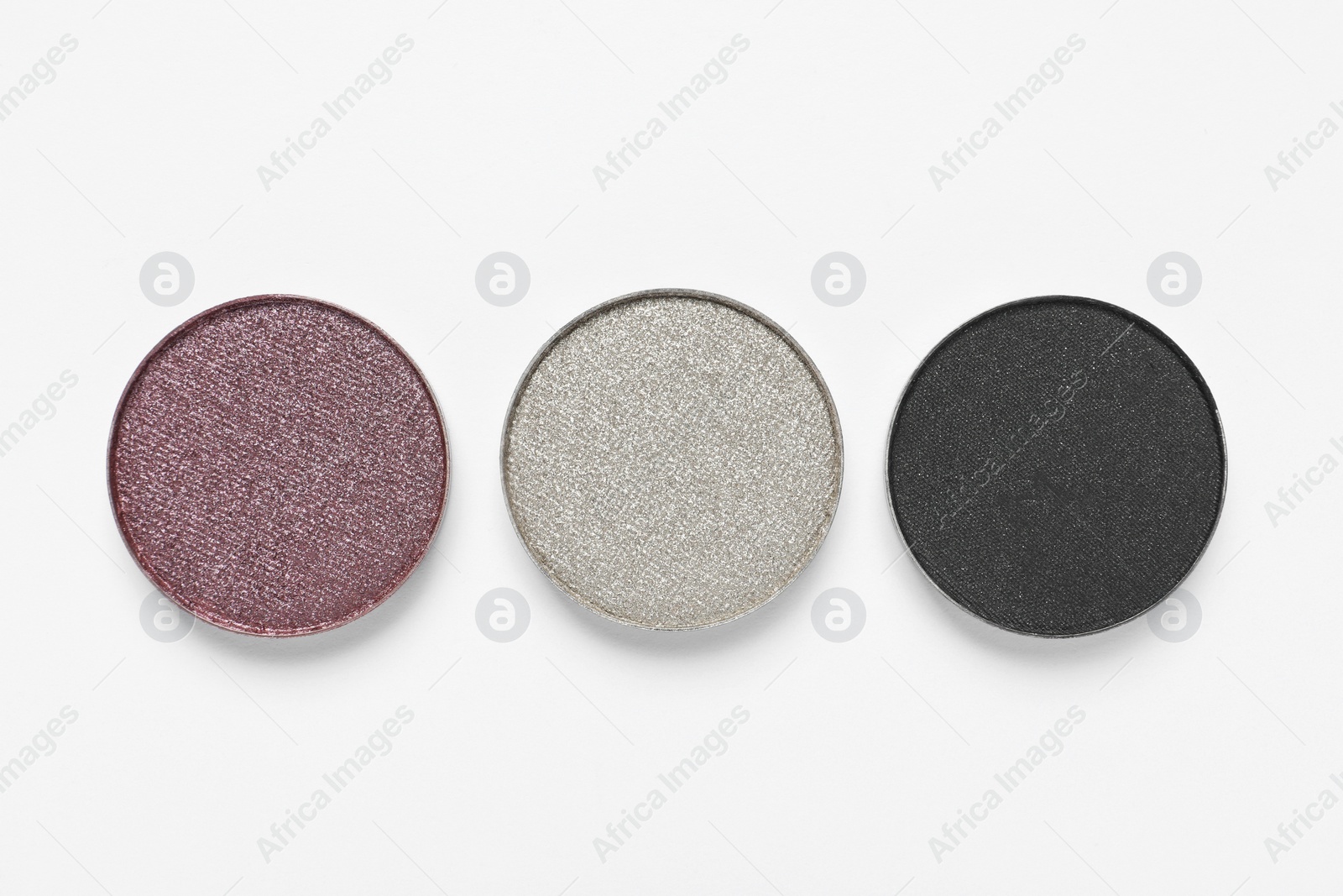 Photo of Different beautiful eye shadows on white background, flat lay