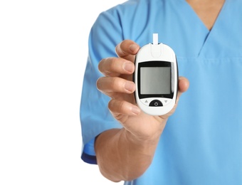 Male doctor holding glucose meter on white background, closeup. Medical object