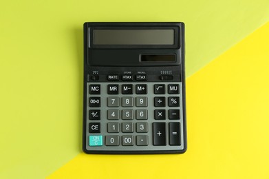 Photo of Modern calculator on color background, top view