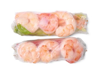 Photo of Tasty spring rolls with shrimps and lettuce wrapped in rice paper on white background, top view