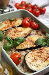 Photo of Delicious eggplant lasagna in baking dish on table, closeup