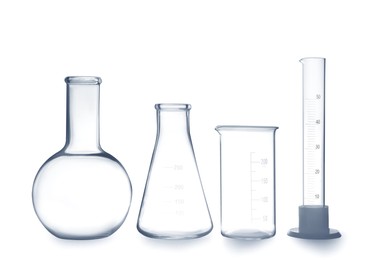 Empty clean laboratory glassware on white background