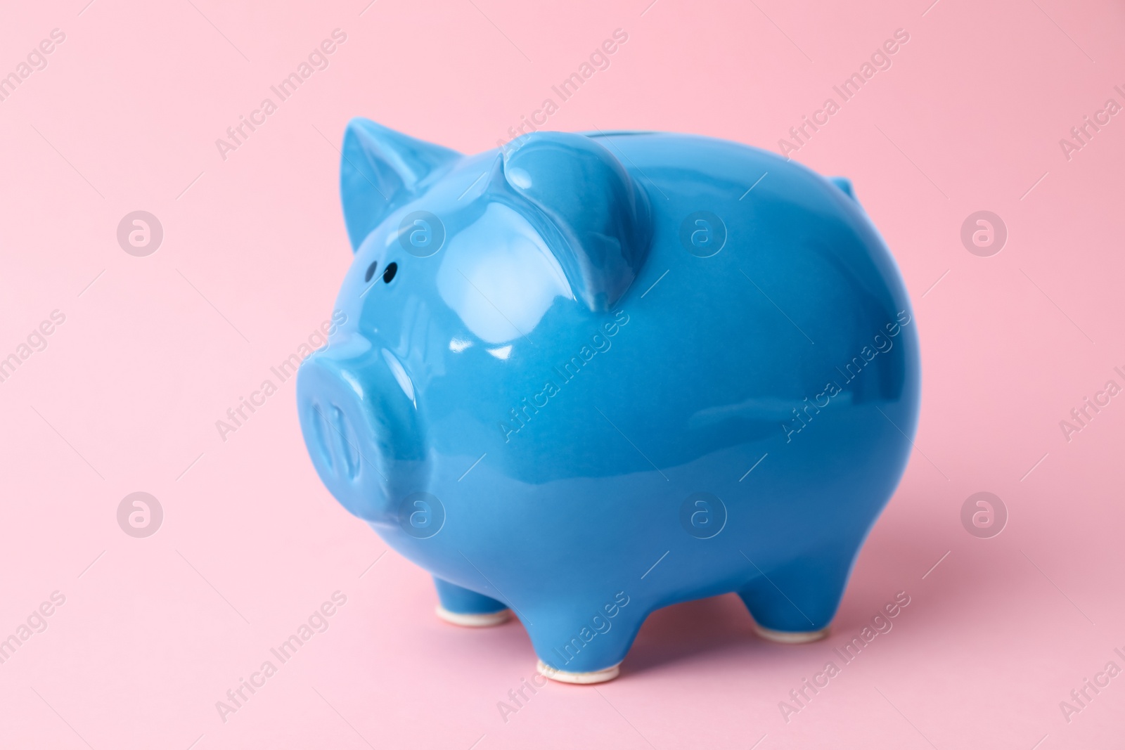 Photo of Blue piggy bank on color background. Money saving