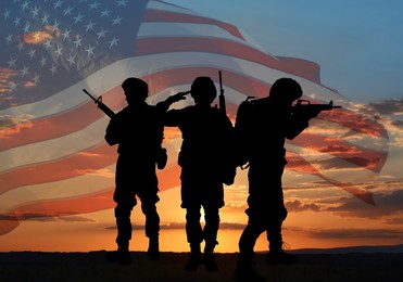 Veterans Day. Silhouettes of military men on sunset outdoors and flag of USA, double exposure