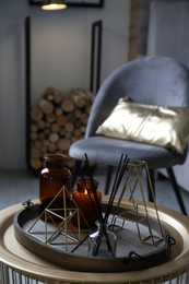 Photo of Wooden tray with decorations on table in room