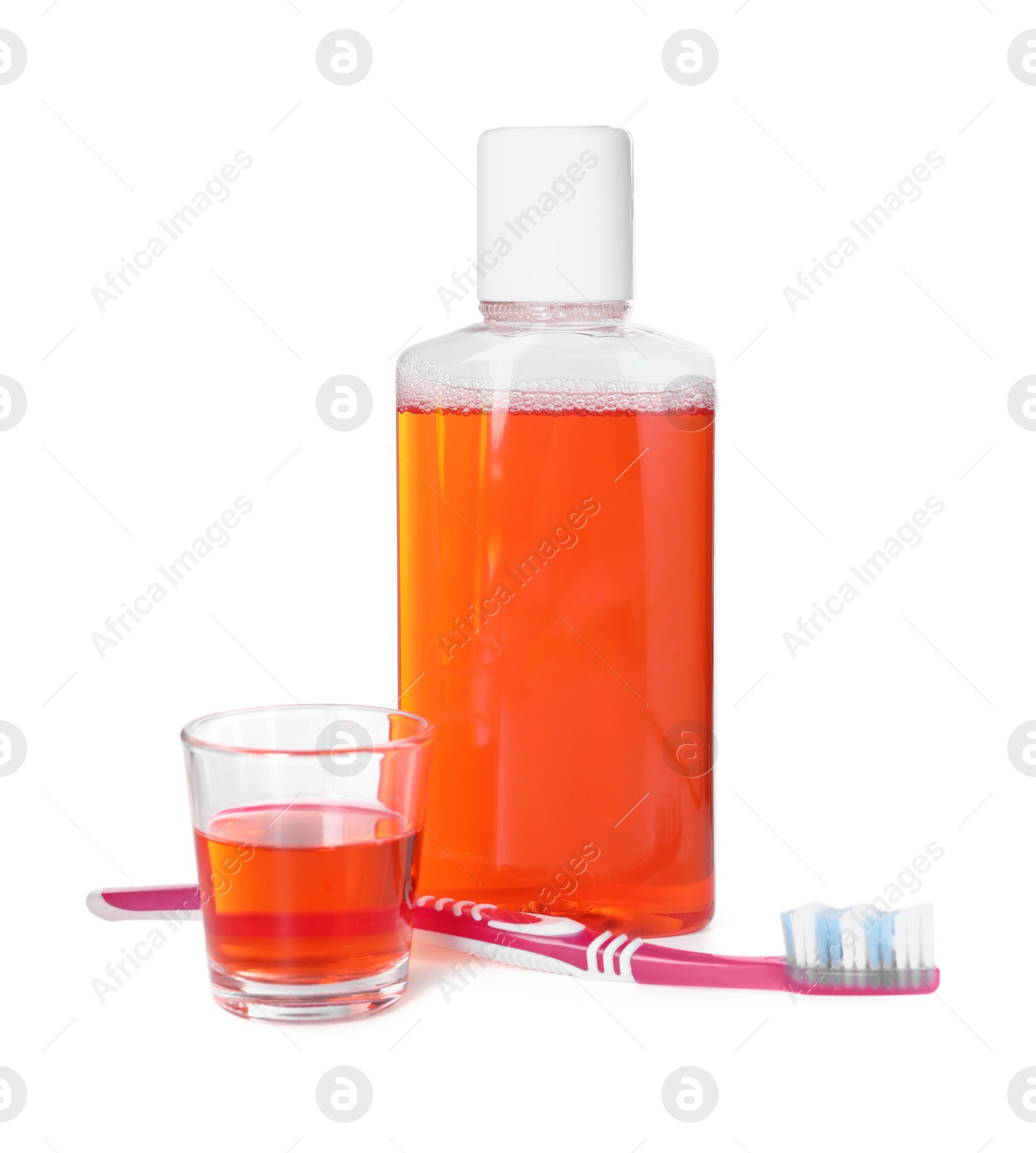 Photo of Mouthwash and toothbrush isolated on white. Oral hygiene