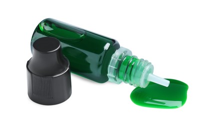 Bottle of green food coloring on white background